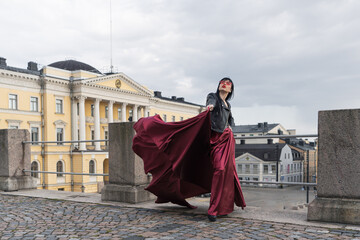 Helsinki. Finland. 25.04.2023 .A sexy woman with a perfect figure stands on Helsinki's Central...