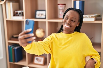 African american woman smiling confident make selfie by smartphone at home