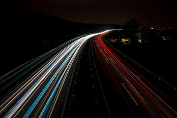 Cars light trails on a straight highway at sunset. Night traffic trails, Motion blur, Night city...