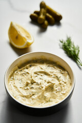 Classic Tartar Sauce dip in the bowl. Mayonnaise with dill and capers plus lemon, shallot onion. Worcester sauce and Dijon Mustard. 