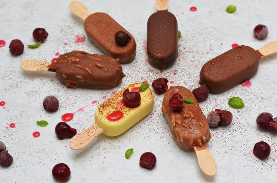 assorted ice cream in chocolate glaze and cherries