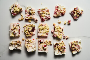 Healthy Frozen Greek Yogurt bars with strawberry with lime zest, nuts and white chocolate. Homemade...
