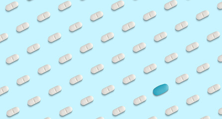 pattern of pills on a light blue background. Many pills on a light blue background