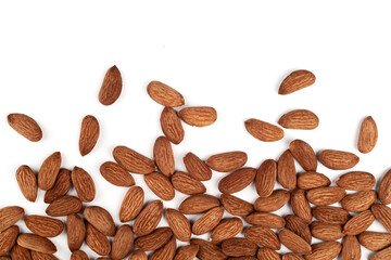 Scattered almonds on a white background.