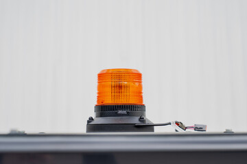 Orange construction safety beacon light