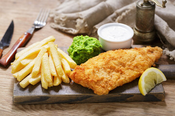 fish and chips on wooden board