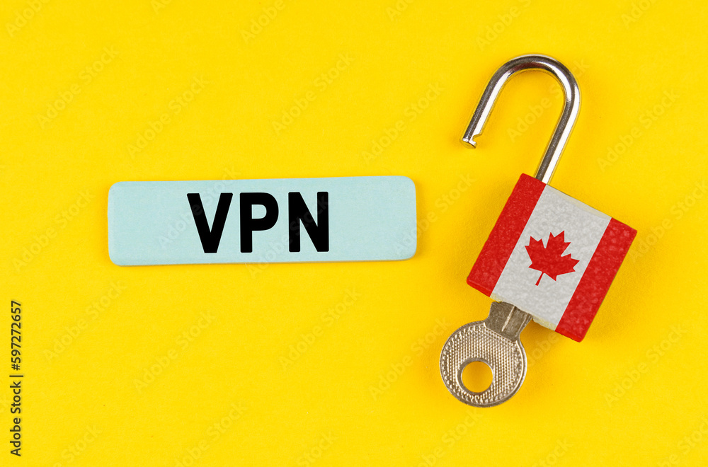 Poster on the yellow surface is an open lock with a key and a sticker with the inscription - vpn