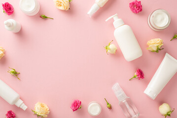 Fototapeta na wymiar Elevate your natural skincare routine with this stunning top view flat lay featuring pump bottles, pipettes, cream bottles, and roses on a pastel pink background. The empty space is for messaging