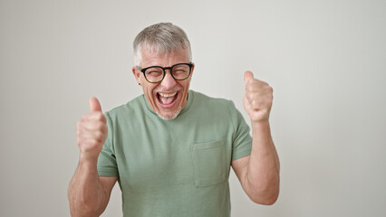 Middle age grey-haired man smiling with thumbs up over isolated white background