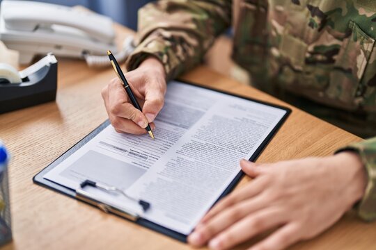 Young Arab Man Army Soldier Signing Contract At Office