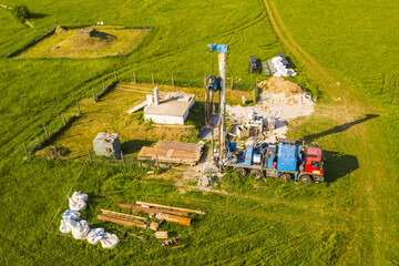 Aerial view of water well drilling. Drilling rig building new groundwater source for entire city....