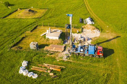 Aerial view of water well drilling. Drilling rig building new groundwater source for entire city. Water management from above.