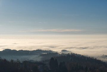 Morning fog in the countryside. Beautiful landscape view over the forest. 