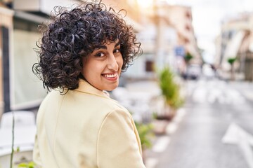 Young middle east woman excutive smiling confident standing at street