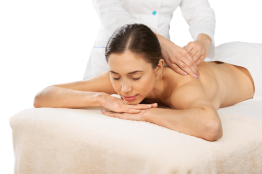 Relaxed young female getting a massage in a spa salon