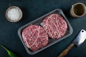 Raw minced meat and ingredients for home made grill burgers. Semifinished food. American cuisine. Raw burger