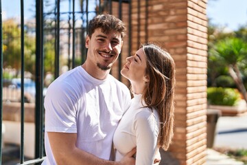 Obraz premium Mand and woman couple hugging each other at street