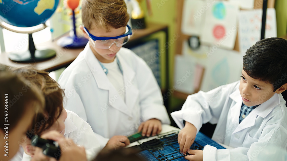 Poster Group of kids students using microscope repairing gadget at laboratory classroom