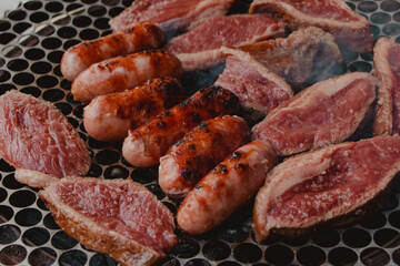 different meats roasting on the barbecue