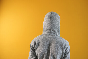 sad man in hood cover hide his face 