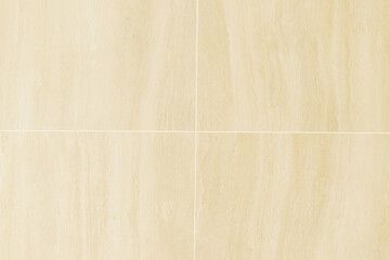 Travertine tiles masonry on wall and floor in unfinished bathroom. Construction of house and home renovation concept. Stylish travertine stone tile close up