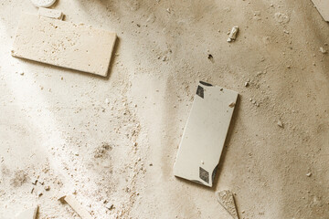 Dirt and broken tiles on floor. Construction of house and home renovation concept. Mess after...