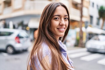 Young beautiful hispanic woman smiling confident standing at street