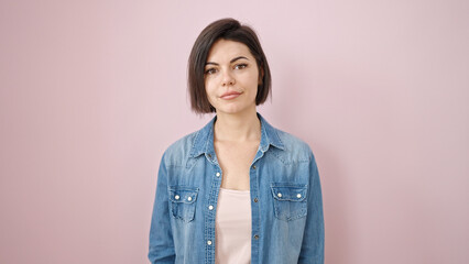 Fototapeta premium Young caucasian woman smiling confident over isolated pink background