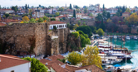 Naklejka premium The old port of Antalya - Antalya Kaleici Yat Limani. The old town. With yachts, boats. and old buildings. View from above. Antalya, Turkiye.