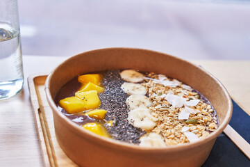  Delicious take away bowl of healthy breakfast at coffee shop terrace