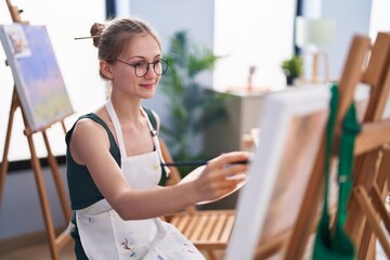 Young caucasian woman artist smiling confident drawing at art studio