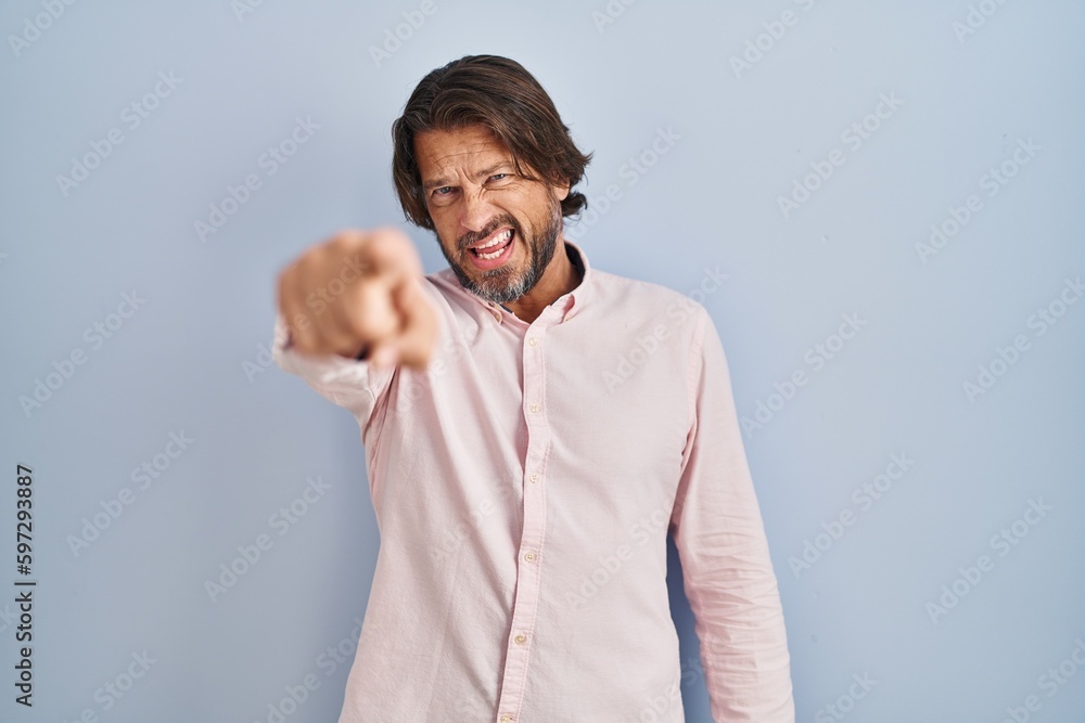 Sticker handsome middle age man wearing elegant shirt background pointing displeased and frustrated to the c