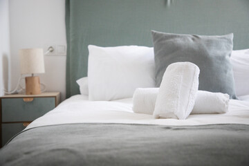 Fototapeta na wymiar hotel bedroom in pastel colors