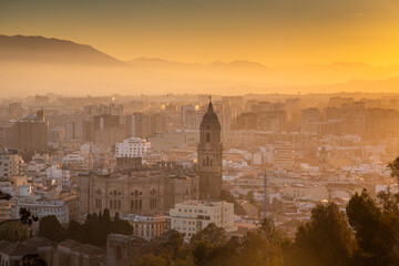 Fototapeta premium view over Malaga at sunset travel banner