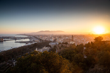 view over Malaga at sunset travel banner