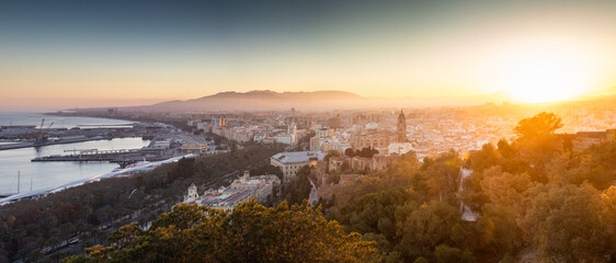 view over Malaga at sunset travel banner