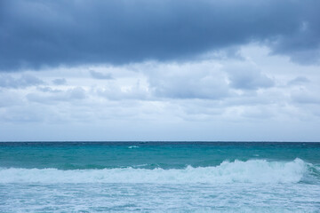 Fototapeta premium Tropical storm in the Atlantic Ocean. Beautiful rolling waves. Hurricane in Caribbean Sea, Gulf of Mexico, Cancun.