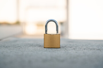 Fototapeta premium padlock security open without its keys over concrete
