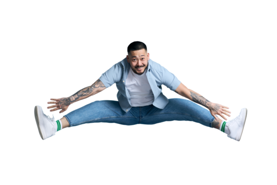 Young overjoyed asian man, gymnast  jumping in twine, having fun isolated on transparent background. Happy Korean hipster with stylish tattoo having fun. Clipping path