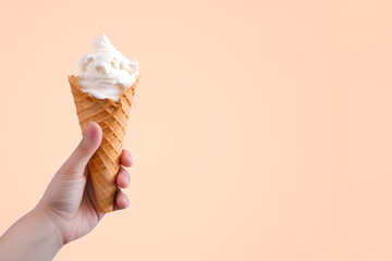 Hand holding delicious vanilla ice cream in a crispy waffle cone with copy space. Created with Generative AI Technology