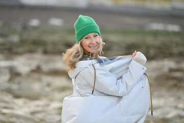Portrait of a fifty-year-old woman with a snow-white smile