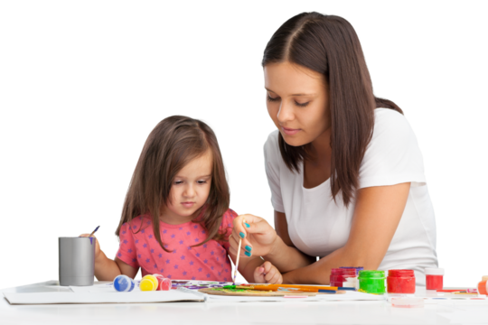 Happy mother and cute little girl doing homework,writing and painting.