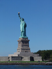 Fototapeta na wymiar Statue of liberty on a sunny day NYC