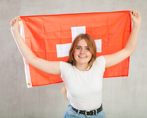 Happy woman supporting Switzerland on world championship