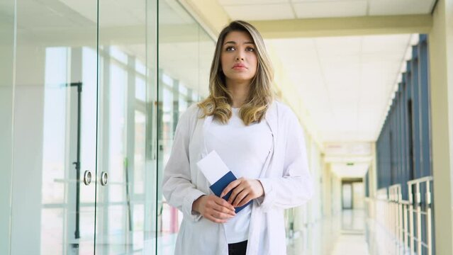 Excited, shocked young beautiful woman looking at the flight information board - missed or cancelled flight concept. Flight delay