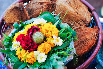 Flower and coconut offerings for Hindu religious ceremony 