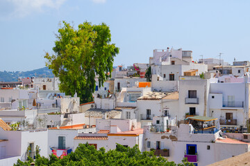 Fototapeta na wymiar Aerial view of whitewashed houses in the city center of Eivissa, the capital of Ibiza in the Balearic Islands, Spain