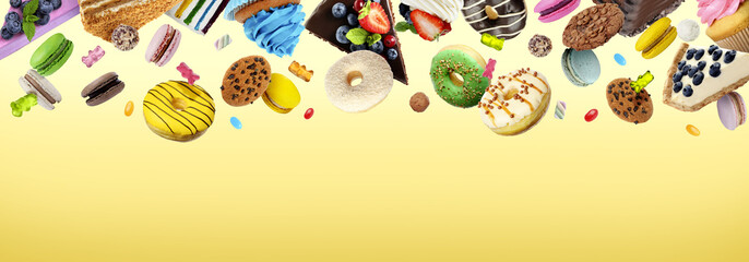 Obraz premium Many delicious sweets falling on yellow gradient background, space for text. Banner design
