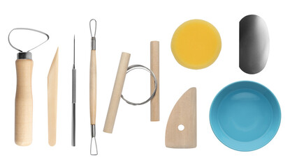 Set of pottery tools and ceramic bowl on white background