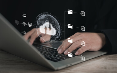 Concept of using cloud computing to store data : Business man using laptop for cloud computing to...